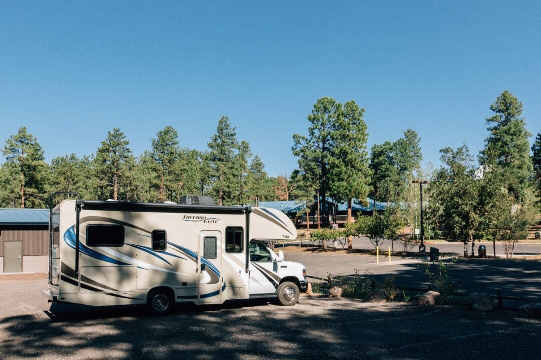 Class C motorhome parked in empty parking lot