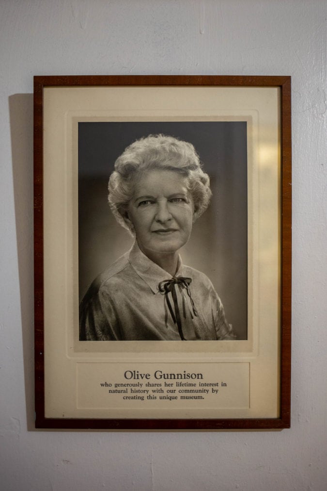 A framed photo of Olive Gunnison hangs near the entrance