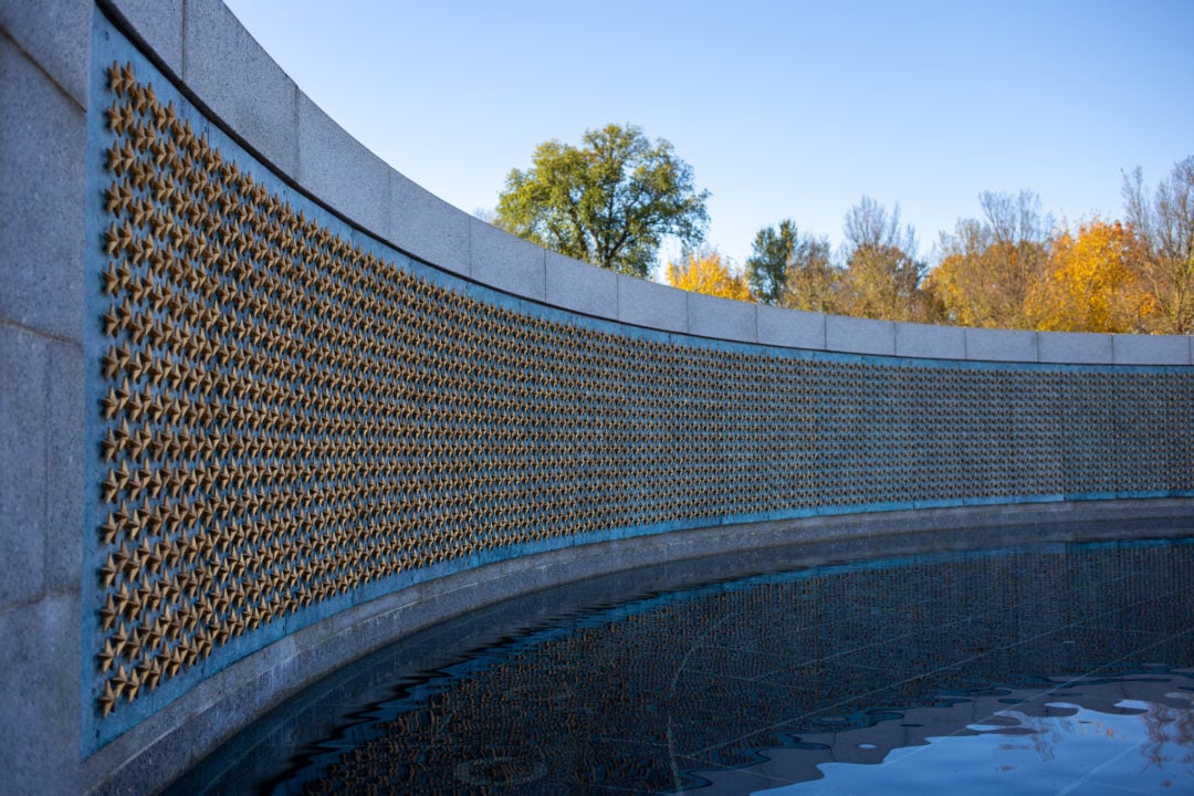 A wall of gold stars at the World War II Memorial, each representing 100 lives lost, highlights the high price of freedom.